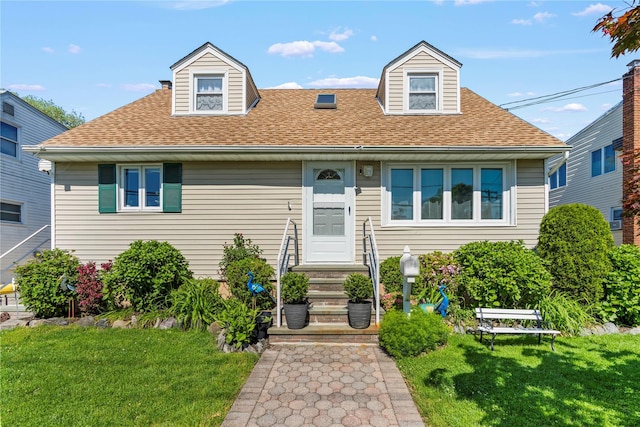 64 Chester Rd, Lynbrook, NY 11563 - view of front of property with entry steps, a shingled roof, and a front yard