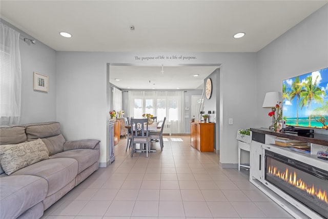 64 Chester Rd, Lynbrook, NY 11563 - living room featuring light tile patterned floors, recessed lighting, and baseboards