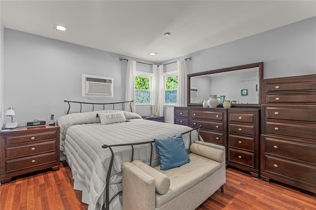 64 Chester Rd, Lynbrook, NY 11563 - bedroom with dark wood finished floors and a wall unit AC