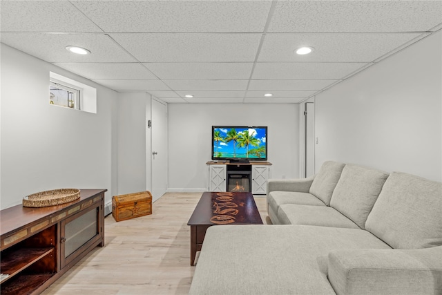 64 Chester Rd, Lynbrook, NY 11563 - living area featuring light wood finished floors, a paneled ceiling, and recessed lighting