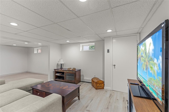 64 Chester Rd, Lynbrook, NY 11563 - living room with light wood-style flooring, baseboard heating, a drop ceiling, and recessed lighting