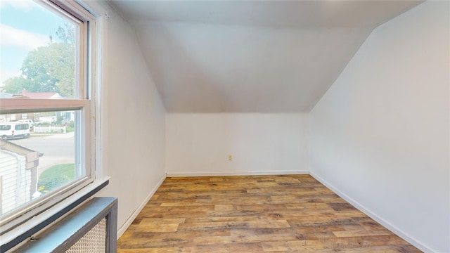 386 Locust Ave, Uniondale, NY 11553 - bonus room featuring lofted ceiling, wood finished floors, and baseboards