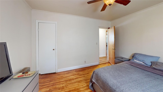 386 Locust Ave, Uniondale, NY 11553 - bedroom with crown molding, light wood-type flooring, baseboards, and ceiling fan