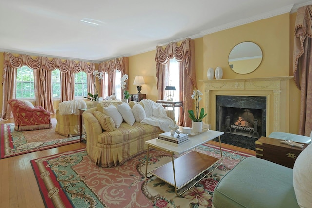 106 Garden Rd, Scarsdale, NY 10583 - living room with wood finished floors, plenty of natural light, a high end fireplace, and crown molding