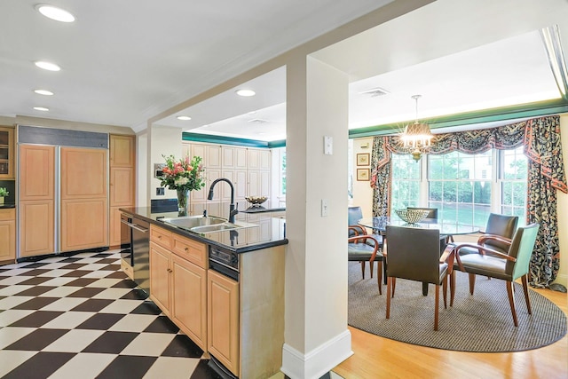 106 Garden Rd, Scarsdale, NY 10583 - kitchen featuring a sink, dark countertops, light flooring, a chandelier, and recessed lighting