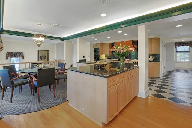 106 Garden Rd, Scarsdale, NY 10583 - kitchen featuring wall chimney range hood, a chandelier, dark countertops, recessed lighting, and a sink
