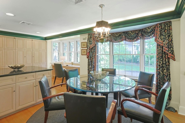 106 Garden Rd, Scarsdale, NY 10583 - dining space featuring a chandelier and light wood finished floors