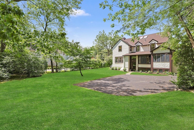 106 Garden Rd, Scarsdale, NY 10583 - view of grassy yard featuring a sunroom