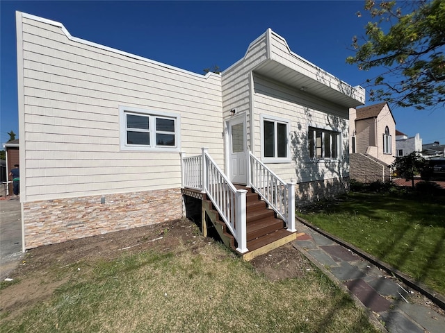 3295 Parkway Dr, Baldwin Harbor, NY 11510 - back of house featuring a yard