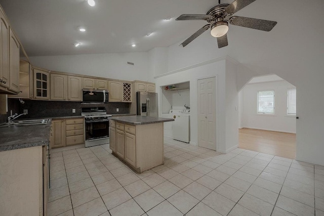 5 Charles St, Selden, NY 11784 - kitchen with appliances with stainless steel finishes, a sink, light brown cabinetry, tasteful backsplash, and high vaulted ceiling