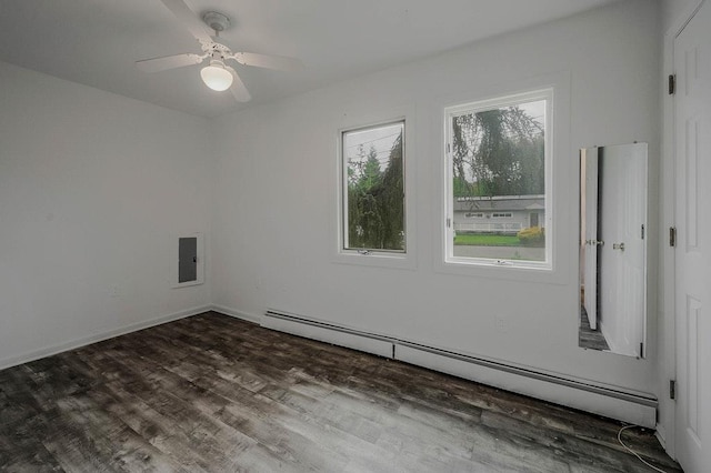 5 Charles St, Selden, NY 11784 - spare room with baseboard heating, wood finished floors, and ceiling fan