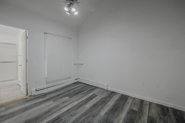 5 Charles St, Selden, NY 11784 - unfurnished bedroom featuring vaulted ceiling, wood finished floors, baseboards, and ceiling fan