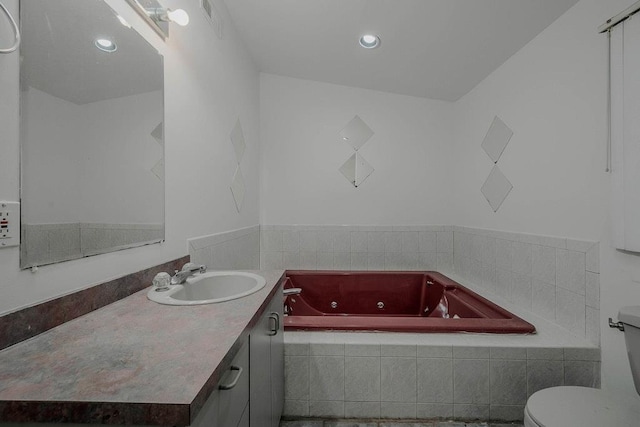 5 Charles St, Selden, NY 11784 - bathroom with a whirlpool tub, toilet, vanity, and recessed lighting