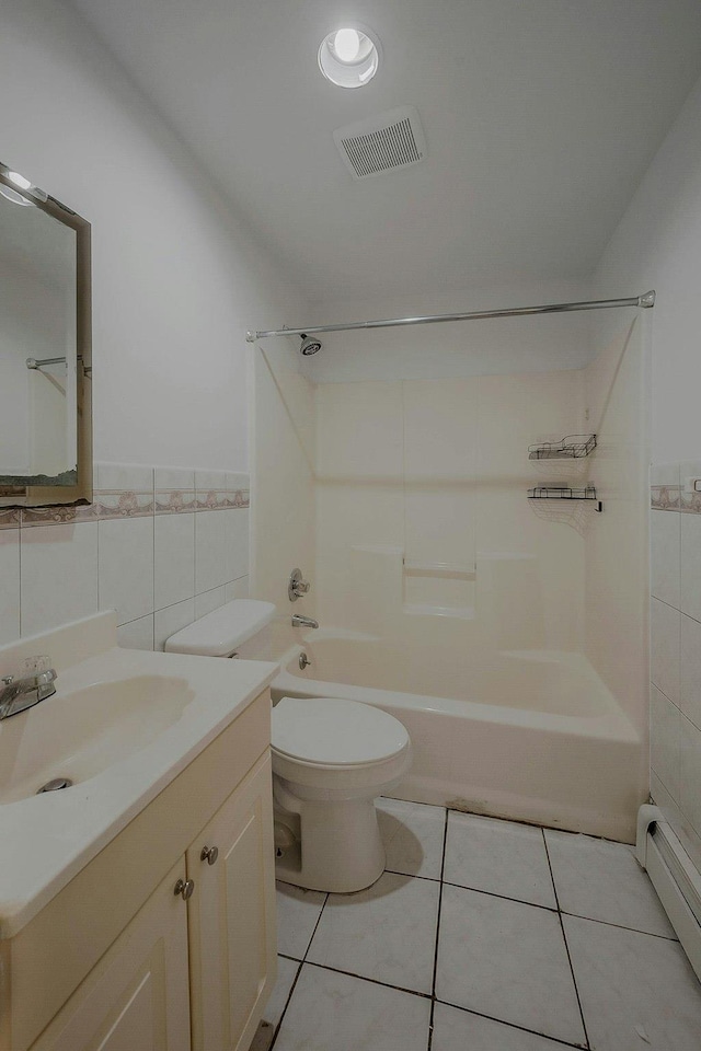 5 Charles St, Selden, NY 11784 - full bath with tile walls, baseboard heating, tub / shower combination, toilet, and vanity