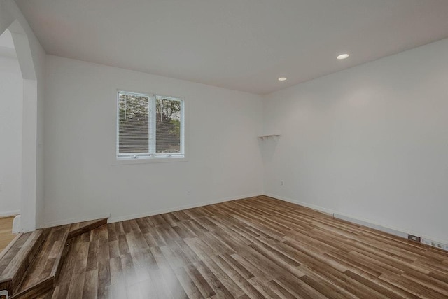 5 Charles St, Selden, NY 11784 - empty room with wood finished floors, recessed lighting, and baseboards