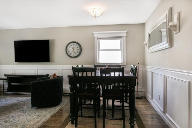 110 Sound Beach Blvd, Sound Beach, NY 11789 - dining area with a decorative wall, dark wood-style flooring, and wainscoting