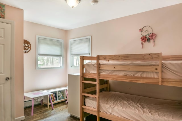 110 Sound Beach Blvd, Sound Beach, NY 11789 - bedroom featuring wood finished floors and a baseboard radiator