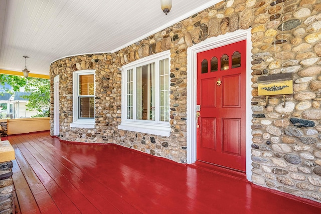 11 Whaley St, Freeport, NY 11520 - entrance to property with a porch and stone siding