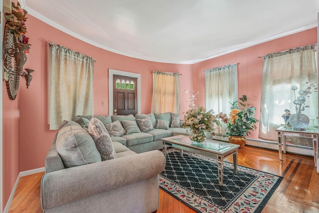 11 Whaley St, Freeport, NY 11520 - living area with crown molding, hardwood / wood-style floors, baseboards, and a baseboard heating unit