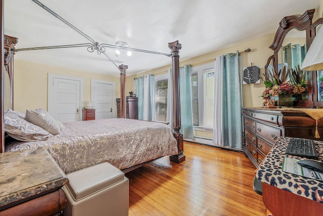 11 Whaley St, Freeport, NY 11520 - bedroom with light wood-style flooring