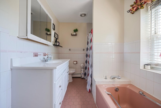 11 Whaley St, Freeport, NY 11520 - bathroom with a garden tub, vanity, toilet, tile walls, and tile patterned flooring