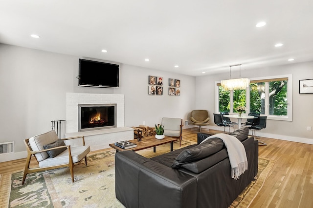 2 Lundy Ln, Larchmont, NY 10538 - living area with recessed lighting, baseboards, a fireplace, and light wood-type flooring