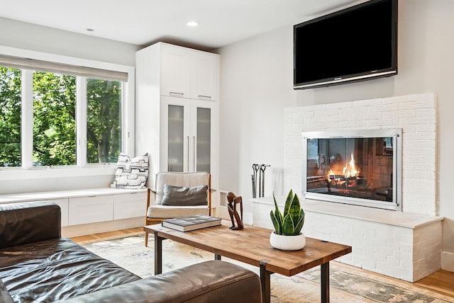 2 Lundy Ln, Larchmont, NY 10538 - living area featuring light wood-type flooring, a brick fireplace, and recessed lighting