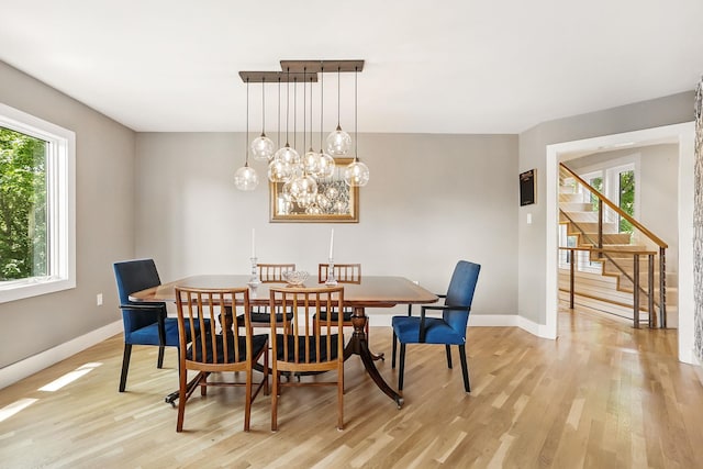 2 Lundy Ln, Larchmont, NY 10538 - dining space with light wood-style floors, healthy amount of natural light, and baseboards