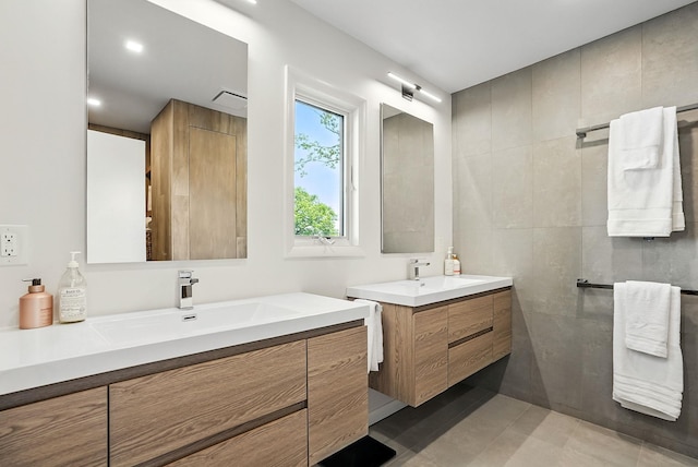 2 Lundy Ln, Larchmont, NY 10538 - bathroom with two vanities, tile walls, and tile patterned floors