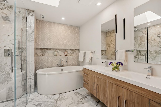 2 Lundy Ln, Larchmont, NY 10538 - full bathroom featuring tile walls, a skylight, a marble finish shower, double vanity, and a soaking tub