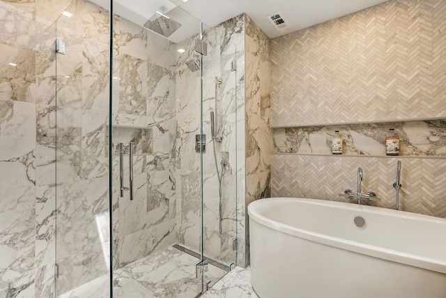 2 Lundy Ln, Larchmont, NY 10538 - bathroom with tile walls, a marble finish shower, and a freestanding bath