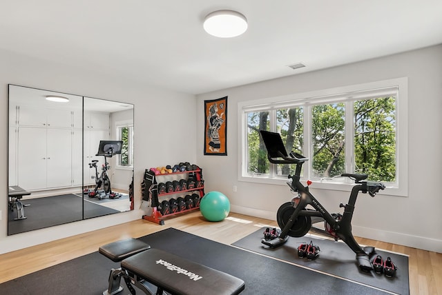 2 Lundy Ln, Larchmont, NY 10538 - workout room with wood finished floors, healthy amount of natural light, and baseboards