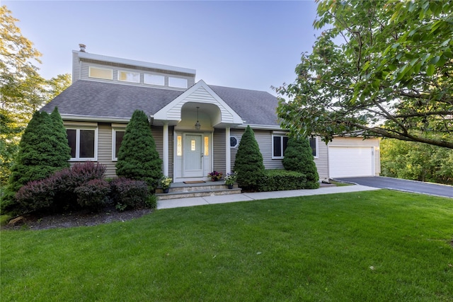 70 Jean Ct, Riverhead, NY 11901 - view of front of property with driveway, a shingled roof, a front yard, and a garage