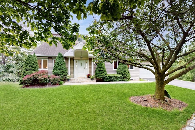 70 Jean Ct, Riverhead, NY 11901 - view of front facade featuring a front lawn and roof with shingles