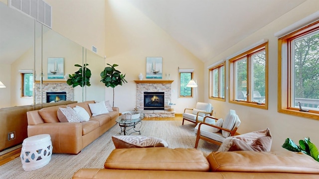 70 Jean Ct, Riverhead, NY 11901 - living room with a fireplace, wood finished floors, and high vaulted ceiling