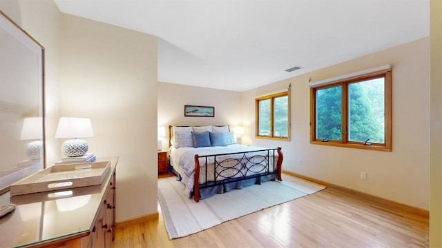 70 Jean Ct, Riverhead, NY 11901 - bedroom with light wood-style flooring and baseboards