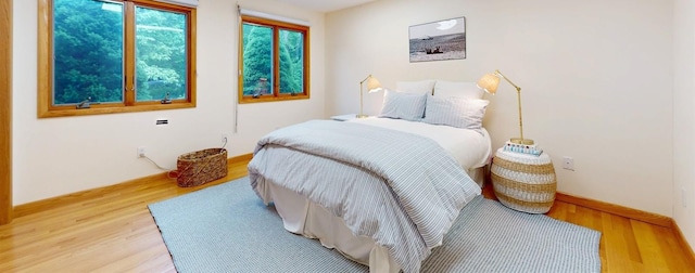 70 Jean Ct, Riverhead, NY 11901 - bedroom with light wood finished floors and baseboards