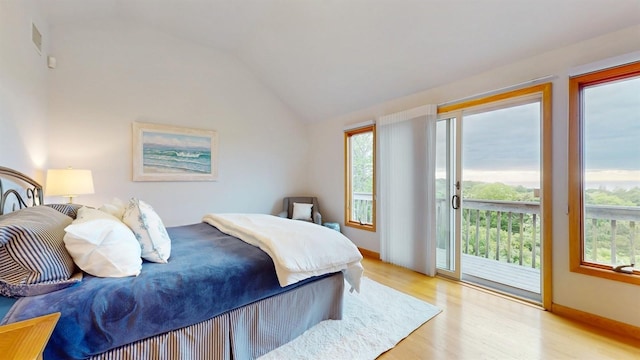 70 Jean Ct, Riverhead, NY 11901 - bedroom with access to outside, light wood-style flooring, and lofted ceiling