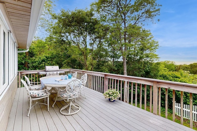 70 Jean Ct, Riverhead, NY 11901 - deck with outdoor dining area, grilling area, and view of wooded area