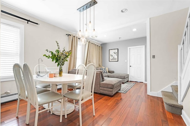 225-35 106th Ave, Queens Village, NY 11429 - dining room with healthy amount of natural light, hardwood / wood-style flooring, a baseboard radiator, stairway, and recessed lighting