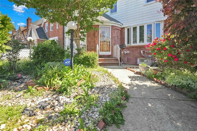 113-23 204th St, Saint Albans, NY 11412 - property entrance featuring a shingled roof