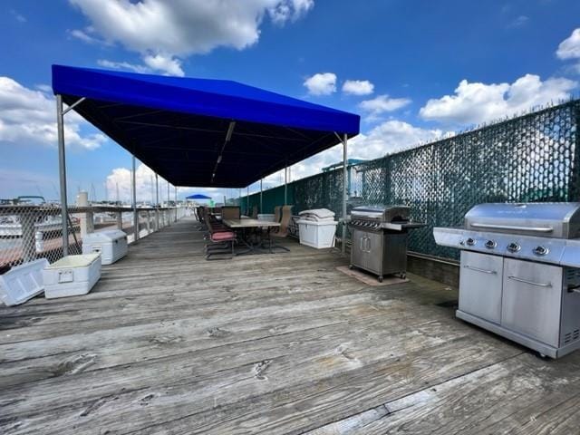 148 City Isalnd Ave Unit D36, Bronx, NY 10464 - wooden deck featuring a grill and outdoor dining area