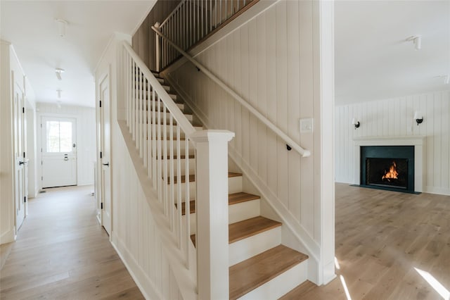 258 Fox Run Rd, Salt Point, NY 12578 - stairs with wood finished floors and a fireplace with flush hearth