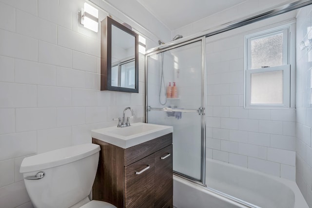 5 Willets Dr, Syosset, NY 11791 - bathroom with vanity, toilet, enclosed tub / shower combo, plenty of natural light, and tile walls