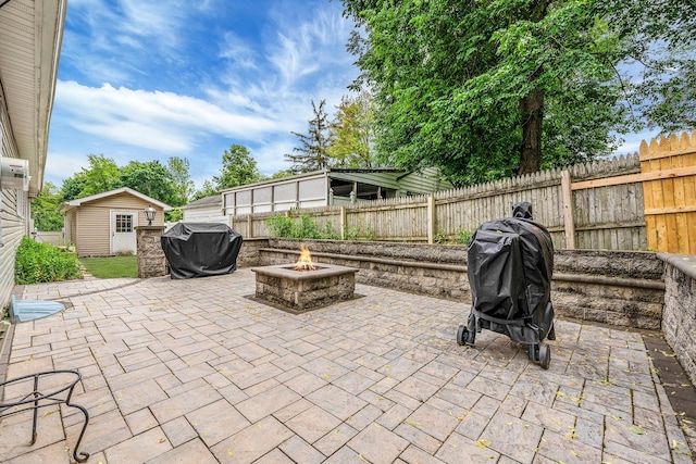 5 Willets Dr, Syosset, NY 11791 - view of patio / terrace featuring a fire pit, a grill, and an outbuilding