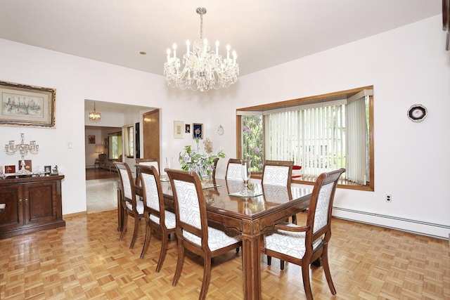 12 Sophia St, Monsey, NY 10952 - dining area with a baseboard radiator, a chandelier, and baseboards