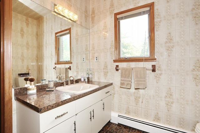12 Sophia St, Monsey, NY 10952 - bathroom with a baseboard heating unit, vanity, tile walls, and toilet
