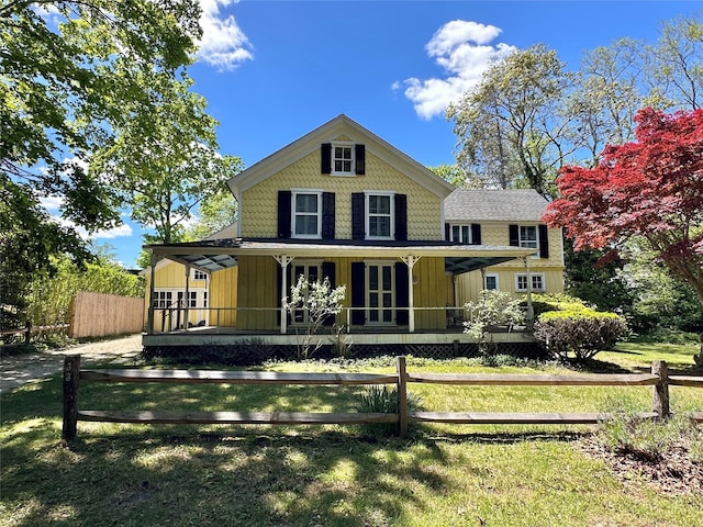 33 Woodbridge Ln, Quiogue, NY 11978 - rear view of property with covered porch, french doors, and board and batten siding