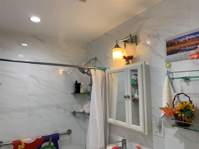 42-40 Bowne St Unit 5C, Flushing, NY 11355 - bathroom with a tile shower and recessed lighting