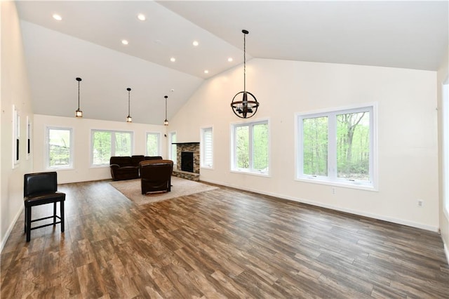11 Brookview Blvd, Chestnut Ridge, NY 10977 - living area with high vaulted ceiling, dark wood finished floors, recessed lighting, a stone fireplace, and a chandelier